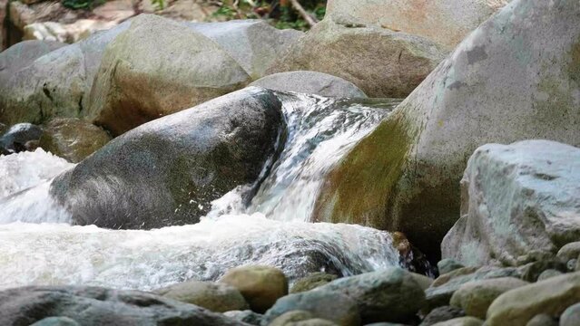 Water Flowing Through Rocks in the Pristine Nus River