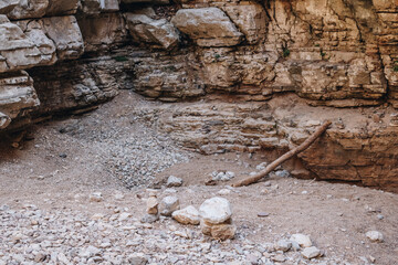 Plunge pool at the bottom of empty river valley inside of Jacob's Canyon