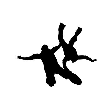 silhouettes of skydiving in the air