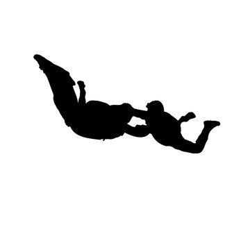 silhouettes of skydiving in the air