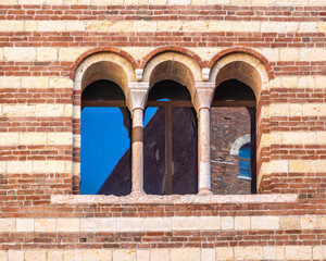 details of the window (Romanesque three-mullioned windows. - Trifora) of the Palace of Reason (Palazzo della Ragione), Verona town, Veneto region in northern Italy