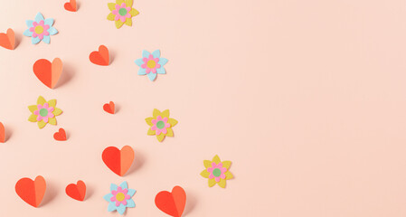 Happy Valentine's day concept. Symbol of love paper art with copy space for text, handmade red paper hearts shape cutting pastel pink background, Mother's Day