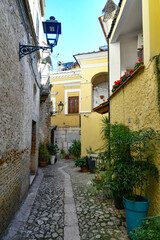 Fototapeta na wymiar An alley between the old houses of Lucera, an ancient town in Puglia, Italy.