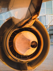 An aircraft turbine engine seen from behind in the sunlight