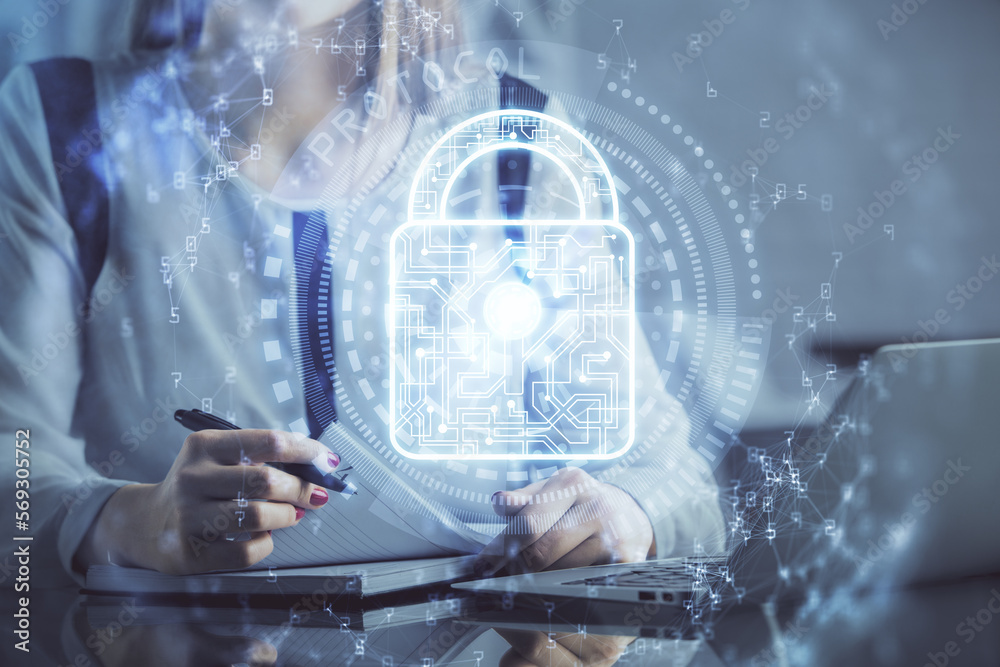 Poster double exposure of woman hands working on computer and lock hologram drawing. security concept.