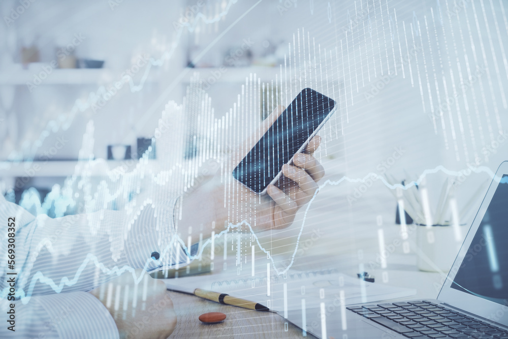 Aufkleber double exposure of man's hands holding and using a digital device and forex graph drawing. financial