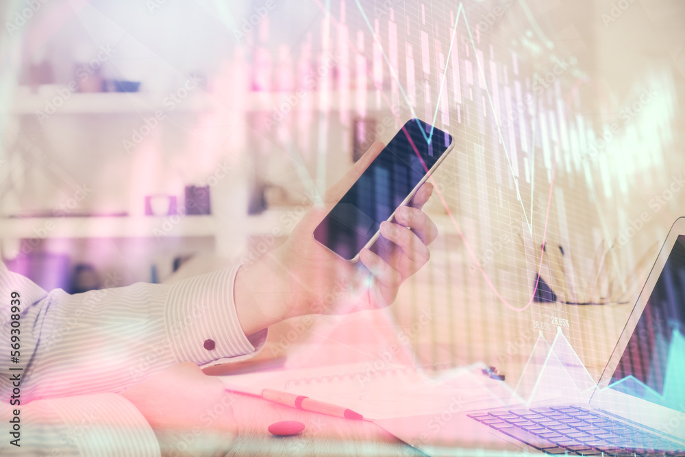 Poster double exposure of man's hands holding and using a digital device and forex graph drawing. financial