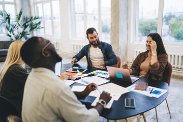 Diverse colleagues working on project in workspace