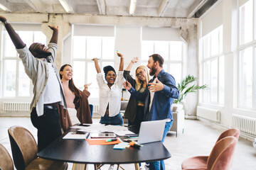 Group of diverse colleagues celebrating victory