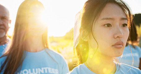 Close up of Young Asian women volunteer memebrs of voluntary organisation conserving nature. People...