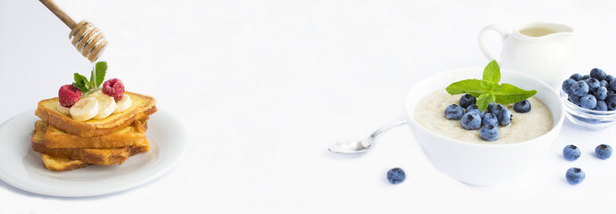 Breakfast. French toasts with fruit and oatmeal with blueberry on the white background. Copy space.