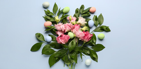 Composition with beautiful flowers, plant branches and Easter eggs on light background