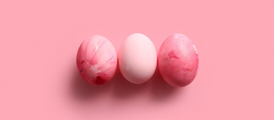 Beautiful painted Easter eggs on pink background
