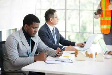 African businessman using smartphone in the meeting room