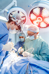 Modern neurosurgery doctors operating in hospital. Medical surgery specialists.