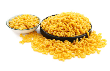 Plates of raw elbow pasta isolated on white background