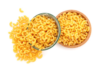 Plates of raw elbow pasta isolated on white background