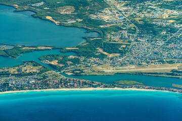 Aerial Landscape view of area around Varadero Peninsula and Santa Marta with parts of old Santa Marta Airport, Laguna de Paso Malo and a long tropical beach 