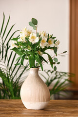Bouquet of alstroemeria flowers on table, closeup