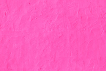 red plaster background with soft structured pattern