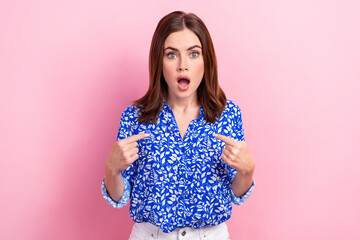 Obraz premium Photo of young confused surprised businesswoman open mouth direct fingers herself blame troubles isolated on pastel pink color background