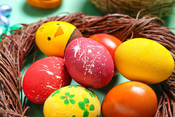 Nest with painted Easter eggs, closeup