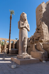 Ramses statue in Luxor Temple on a sunny day.