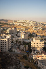 Fototapeta na wymiar Old Bethlehem Cityscape in the Foreground and Newer Colonies in the Background with White Stone Classic Architecture
