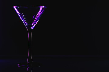 silhouette of martini glass on black background