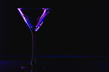 silhouette of martini glass on black background