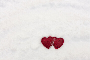two hearts on white snow, valentines day background, free space for text