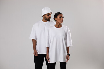 African american couple in white t-shirts. Man in white panama. Mock-up.