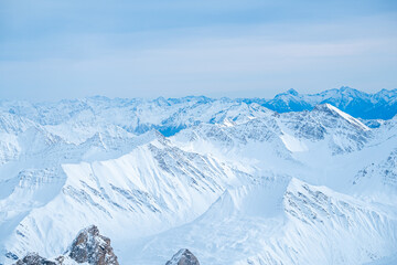 Beautiful panorama of snow capped mountains during sunset