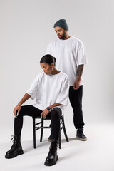 African american couple in white t-shirts. Mock-up.