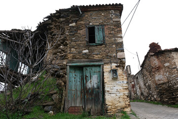 Fototapeta na wymiar izmir, bayındır, yusuflu, Turkey 02.06.2023 A view from the historic village with stone-walled houses with wooden windows and doors