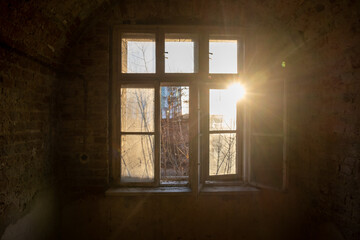 Antique wooden dirty window in sunlight