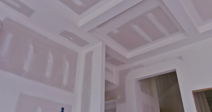 There has been significant amount of plastering drywalling completed in new house under construction, it is now ready for painting