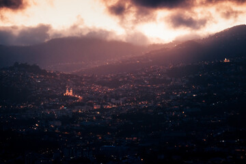 drone view of funchal night city, lights and darkness