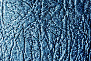 Blue color leather fabric. Fashion pattern background. Black textile texture.