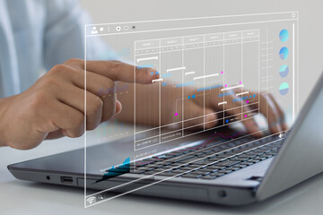 Project management concept. Analyst working with computer in Business Analytics and Data Management System to make report with KPI and metrics connected to database. Corporate strategy for finance.