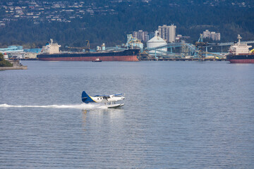 Obraz premium seaplane starting near vancouver harbor for a flight