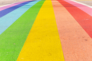 rainbow colors on a street as a symbol for community, diversity, pride and self-assertion, for the...