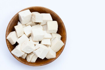 White tofu in wooden bowl on white background