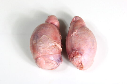 Raw lamb testicles on white background