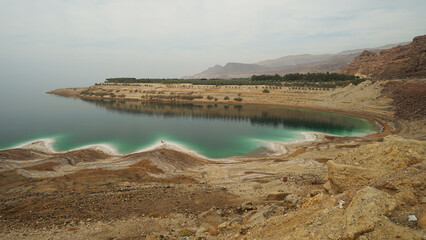 Dead Sea panoramic view with salt on shores and clear water, Jordan and Israel, Dead Sea