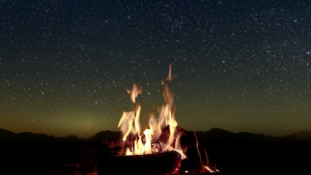 bonfire burns at night against the background of mountains and sea with bright stars