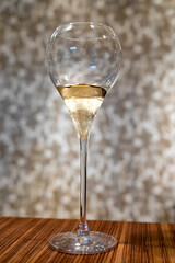 Tasting of cold brut Champagne sparkling wine in cellars of gran cru wine house in near Reims, wine tour in Champagne, France