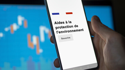 An investor subscribing on phone to the environmental protection support for enterprise. Text in French.