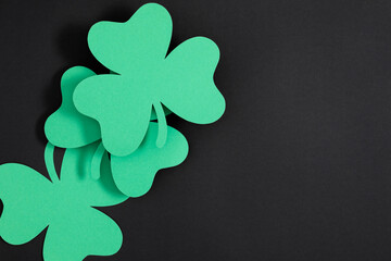 Patrick's Day composition. Holiday decoration for St. Patricks day, clover leaf on black and green...