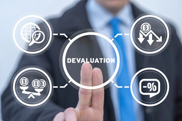 Businessman working on virtual touchscreen of future and sees word: DEVALUATION. Currency Depreciation Concept. Financial crisis, recession and depression.